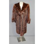 A vintage De Bella 3/4 length fur coat.