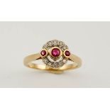 A 15ct gold, diamond and ruby ring, size P, 3.5g.