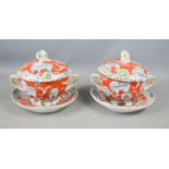 Two 19th century stoneware soup tureens, plates and covers, with twin handles and knop finials,