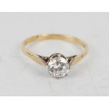 A silver gold plated solitaire ring, size V.