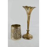 A silver tankard embossed with maid holding a brush, 1.86toz, together with a silver bud vase,