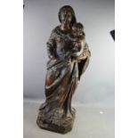 A 17th century carved figure of the Madonna and Child.