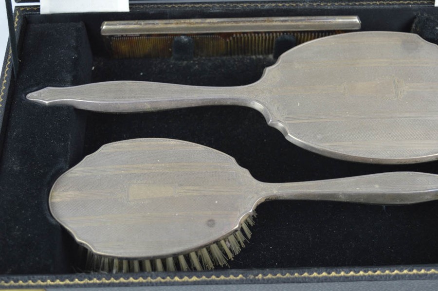 A silver dressing table set, comprising hair brush, hand mirror, clothes brush and comb, in - Image 2 of 2