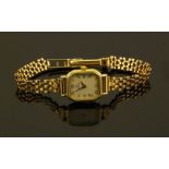 An Omega 9ct gold ladies quartz 1450 wristwatch - , in original Omega presentation case, and two