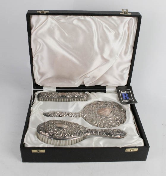 A silver dressing table set by Broadway & Co, in presentation box.