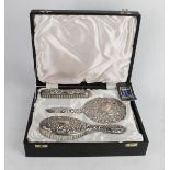 A silver dressing table set by Broadway & Co, in presentation box.