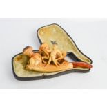 A 19th century Meerschaum pipe, carved with horse and stable boy, in original box.