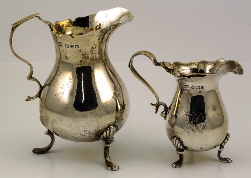 Two silver jugs; one Chester 190, one Birmingham 1927.