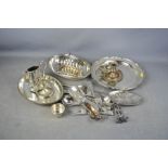 A group of silver plate ware to include candlesticks, trays and other items.