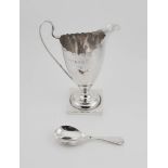 A silver jug and a silver christening spoon, 3.68toz.