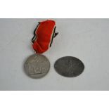 A Munchen 1923-1933 medal together with a Gestapo badge marked M9/86