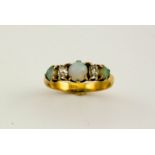 An 18ct gold, diamond and opal ring, size M/N, 3.4g.