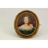 A Victorian Pinchbeck revolving mourning brooch, depicting a portrait of Eleanor Eaton, Died Dec