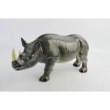 A Melba Ware porcelain rhinocerous, 13cm high.