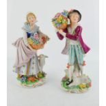 A pair of Sitzendorf porcelain figures, 'Flower Sellers', 19cm high