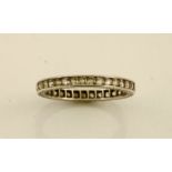 A white metal and diamond band, size T, 2.5g.