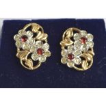 A pair of 9ct gold, diamond and ruby twin flower head stud earrings.