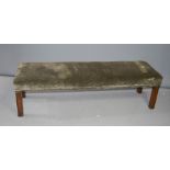 An antique long stool, with grey velvet upholstered top, 33 by 110 by 33cm.