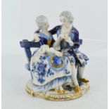 A German porcelain Volkstedt 1762 figure group in blue white and gold, courting couple on a bench,