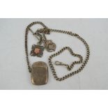 A silver vesta case, pocket watch chain and two fobs, 3.32toz.