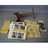 A Victorian stereoscope viewer and viewing cards; including views of the Isle of Wight, Natural
