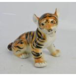 A Russian Lomonosov porcelain tiger cub 13cm high.