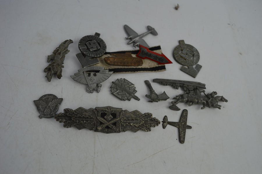 A group of German badges / clasps to include a close combat clasp - a proficiency badge together