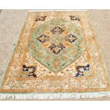 A silk Middle Eastern rug, 235 by 158cm.