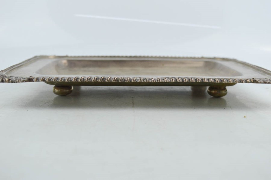 A silver rectangular dish raised on four bun feet, with scallop shells to the corners and decorative - Image 2 of 3