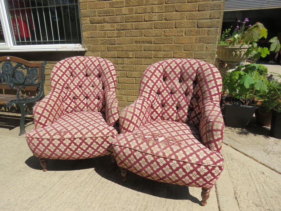 A pair of button back armchairs