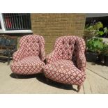 A pair of button back armchairs