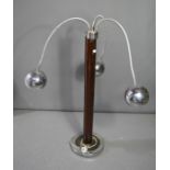A Mid-Century chrome standard lamp, with three articulated lights of spherical for, with a brown