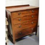 An Edwardian chest of drawers, with four long graduated drawers and bell flower appliques, 98 by