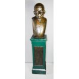 A 1930s bronze bust of a man, raised on a painted wooden pedestal, signed, 180cm high in total.