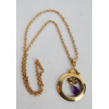 A 9ct gold Edwardian pendant necklace and chain with bow and pear cut amethyst, 9.1g.