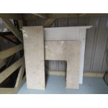 A fireplace grate and back made from wood and marble