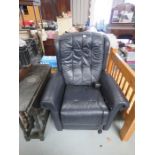 A blue leather electric reclining armchair.