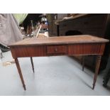 A mahogany desk table with brown leather top