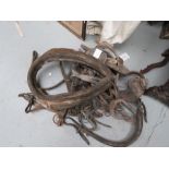 A group of old horse tack including collar and bit