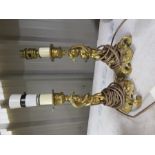 Two cast brass lamp bases in the form of cherubs.