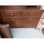 An Edwardian mahogany chest with two short over one long drawer and two cupboard doors.