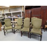 A set of six modern upholstered dining chairs, upholstered in green fabric.
