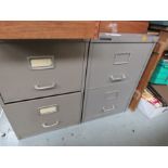 Two grey metal filing cabinets.