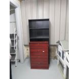 A modern shoe rack and black bookcase.