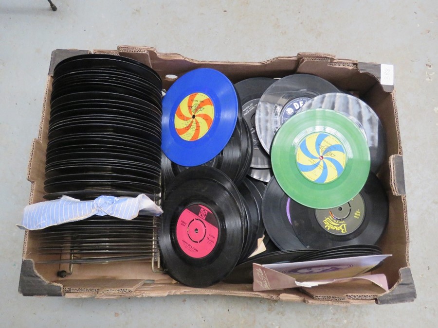 A box of Vinyl Records and a record rack