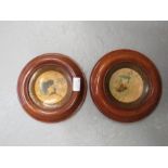 Two oak roundels with print profile portraits.