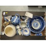A group of blue and white egg cups, candlesticks, teapot, biscuit barrel and other items.
