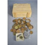 A quantity of coins to include commemorative coins and pennies.