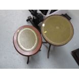 Two oval top tripod tables.