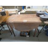 An oak drop leaf table.